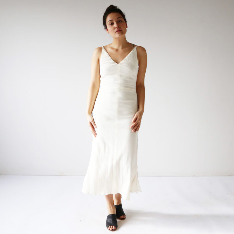 Front view of straight size model wearing Cream Myrtle Dress.