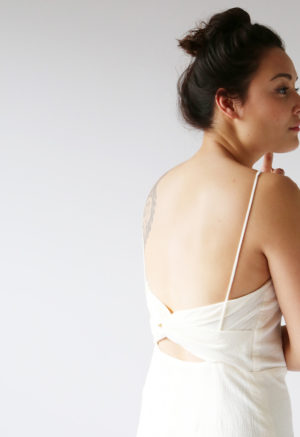 Close-up back view of straight size model wearing Cream Myrtle Dress.