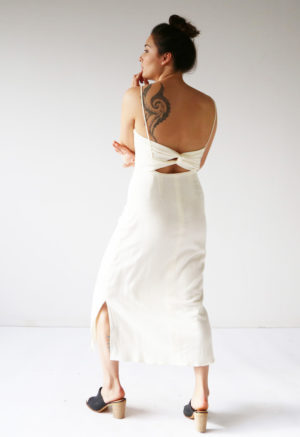 Back view of straight size model wearing Cream Myrtle Dress.