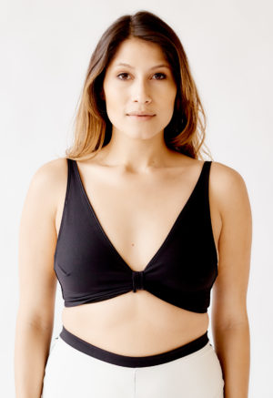 Front view of straight size model wearing Black Knot Top.