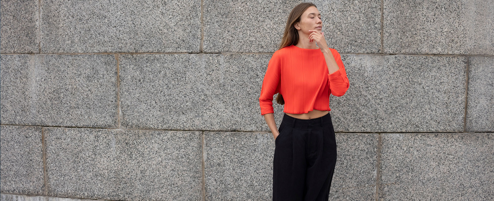 woman in bright red top and black pants