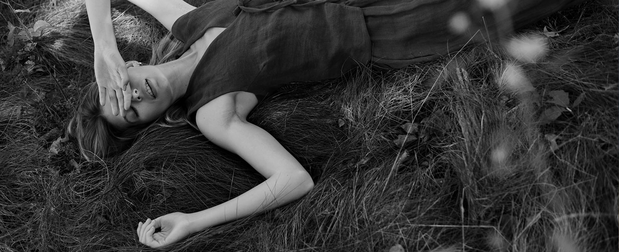 woman lying in grass