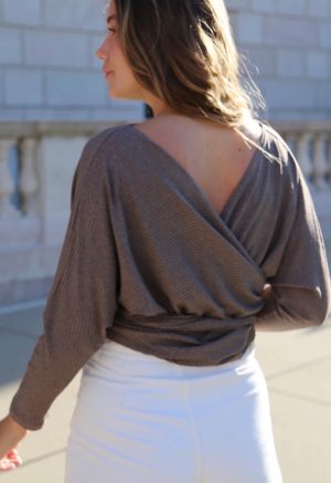 Back view of straight size model wearing Mauve Rib Everything top.