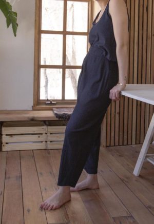 Side view of straight size model wearing Navy Rib Easy Ribbed Pant.