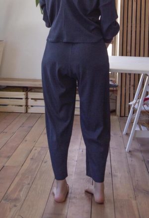 Back view of straight size model wearing Navy Rib Easy Ribbed Pant.