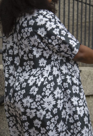 Close up back view of plus size model wearing Gathered Midi Dress in Jungle Green Floral.