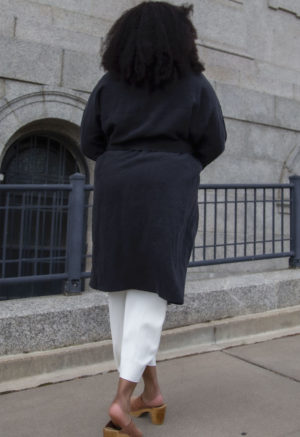 Back view of plus size model wearing Lapel Midi Jacket in Black Linen.