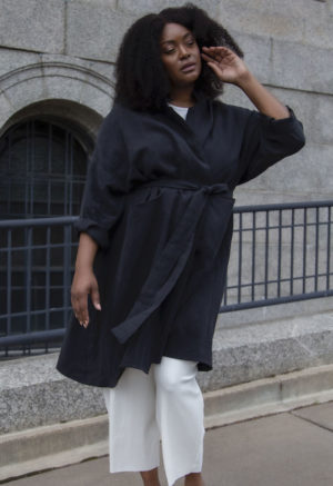 Front view of plus size model wearing Lapel Midi Jacket in Black Linen.