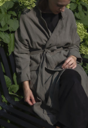 Front view of straight size model wearing Lapel Midi Jacket in Moss Linen.