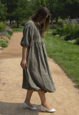 Side view of straight size model in Oversized Dress in Moss Linen.
