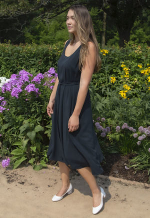 Front view of straight size model wearing Reversible Scoop Dress in Liquorice Lyocell.