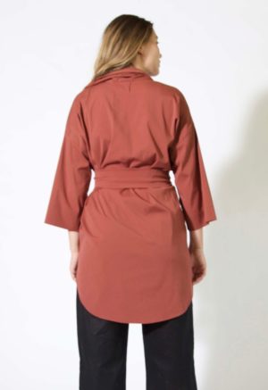Back view of straight size model wearing Sustain Button Up Jacket.