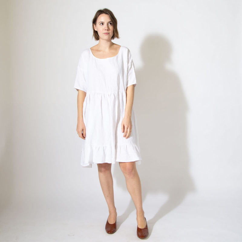 Front view of straight size model wearing sample 529 in white cotton.