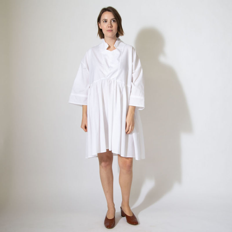 Front view of straight size model wearing sample 528 in white cotton.