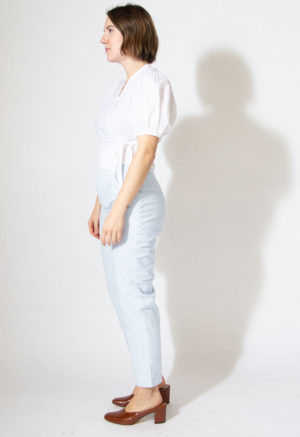 Side view of straight size model wearing Sample 522 in white cotton.