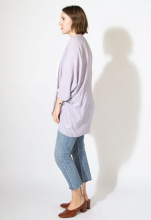 Side view of straight size model wearing Easy Jacket in lilac.