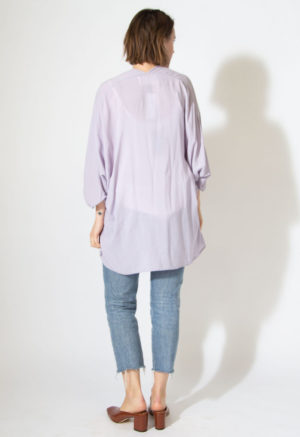Back view of straight size model wearing Easy Jacket in lilac.