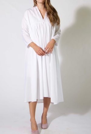 Front view of straight size model wearing Sustain sample 502 in white cotton.