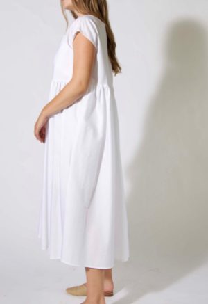 Side view of straight size model wearing sample 505 in white cotton.