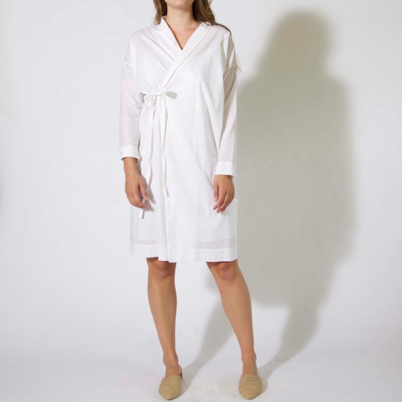 Front view of straight size model wearing Long Sleeve Wrap Dress