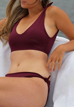 Front view of straight size model wearing shoulder tie top in fig.