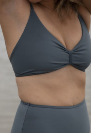 Front view of straight size model wearing Skinny Knot Top in Storm.