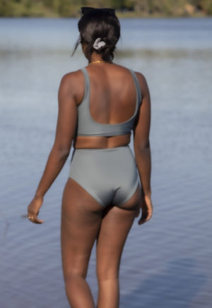 Back view of straight size model wearing Sporty Scoop Top in Storm.