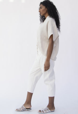 Side view of straight size model wearing Artist Pant in White Cotton/Hemp.