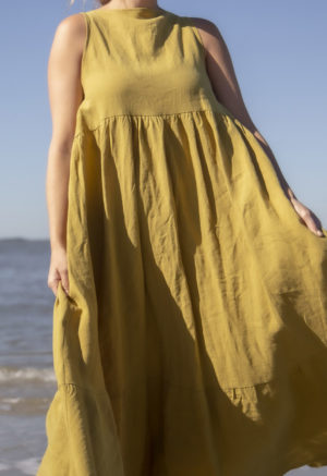 Front view of straight size model wearing Boatneck Tank Dress in Avocado Linen.