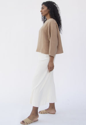 Side view of straight size model wearing Cropped Pullover in Latte Linen.