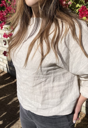 Side view of straight size model wearing Cropped Pullover in Oatmeal Linen