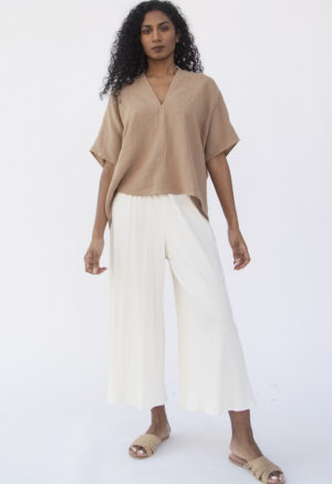 Front view of straight size model wearing Double V Top in Latte Linen.