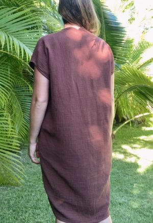 Back view of straight size model wearing Double V Kaftan in Raisin Cotton