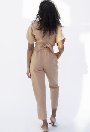 Back view of straight size model wearing Easy Tapered Pant in Latte Linen.