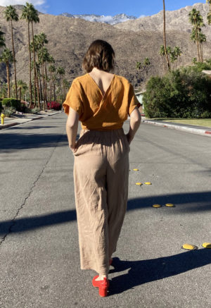 Back view of straight size model wearing Easy Wide Leg Pant in Latte Linen.