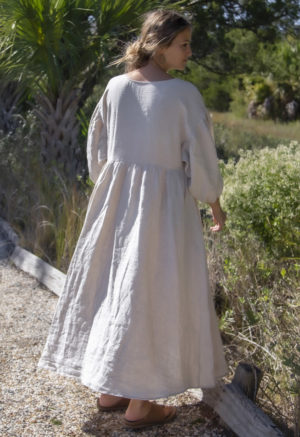 Back view of straight size model wearing Oversized Dress in Oatmeal Linen.