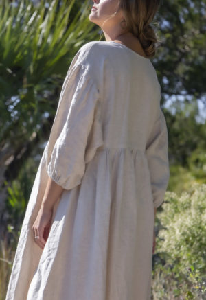 Back view of straight size model wearing Oversized Dress in Oatmeal Linen.