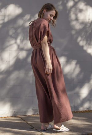 Side view of straight size model wearing Oversized Jumper in Raisin Cotton.