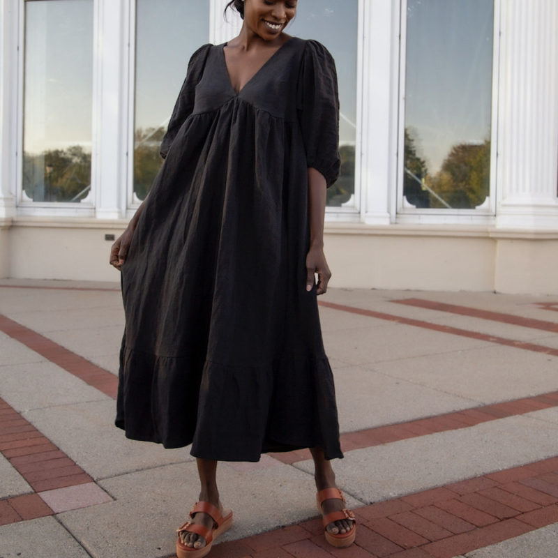 Front view of straight size model wearing Ruffle Midi Dress in Black Linen.