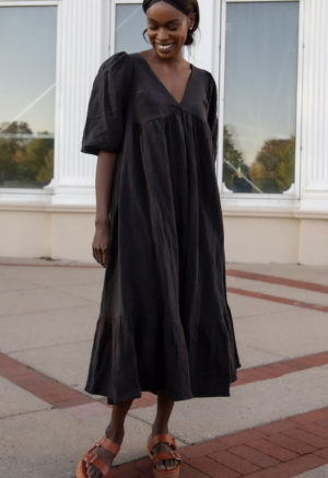 Front view of straight size model wearing Ruffle Midi Dress in Black Linen.