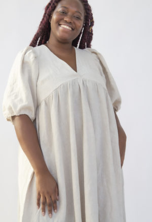 Front view of plus size model wearing Ruffle Midi Dress in Oatmeal Linen.