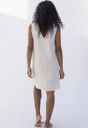 Back view of straight size model wearing Shift Dress in Oatmeal Linen.