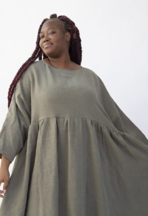 Front view of plus size model wearing Short Oversized Dress in Moss Linen.
