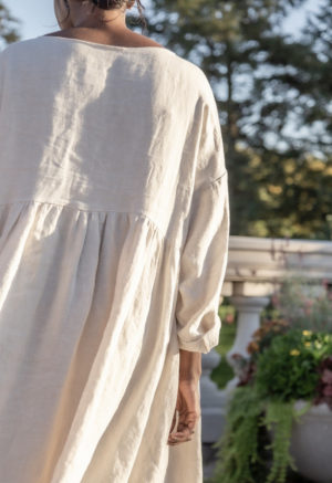 Back view of straight size model wearing Short Oversized Dress in Oatmeal Linen