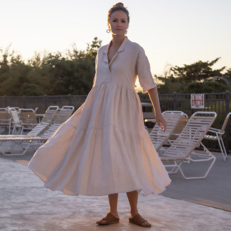 Front view of straight size model wearing Tiered Lapel Dress in Oatmeal Linen.
