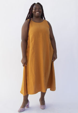 Front view of plus size model wearing Reversible Scoop Dress in Saffron Linen.
