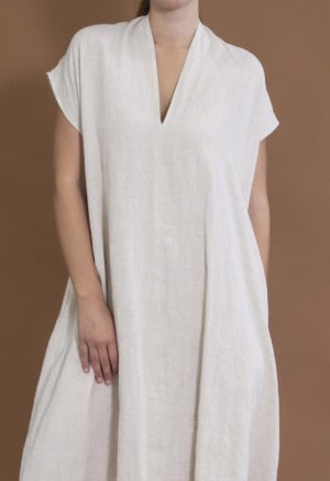 woman wearing oatmeal linen line v-neck short sleeve midi length swing dress