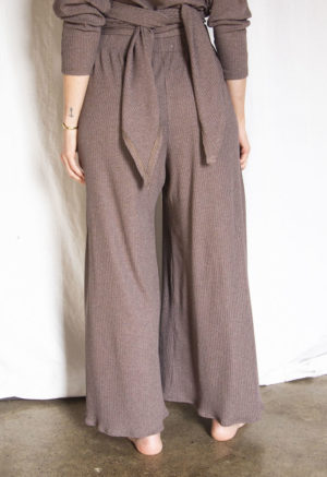 Back view of straight size model wearing Mauve Rib Extra Wide-Leg Ribbed Pant.