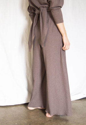 Back view of straight size model wearing Mauve Rib Extra Wide-Leg Ribbed Pant.