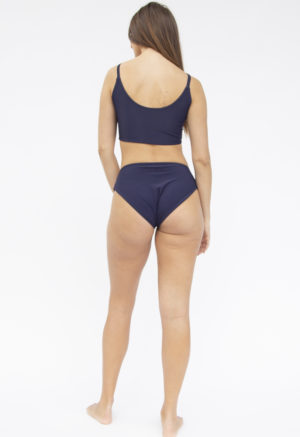 Back shot of straight size model in Two-Way Top and Bikini Bottoms in Indigo Rib.